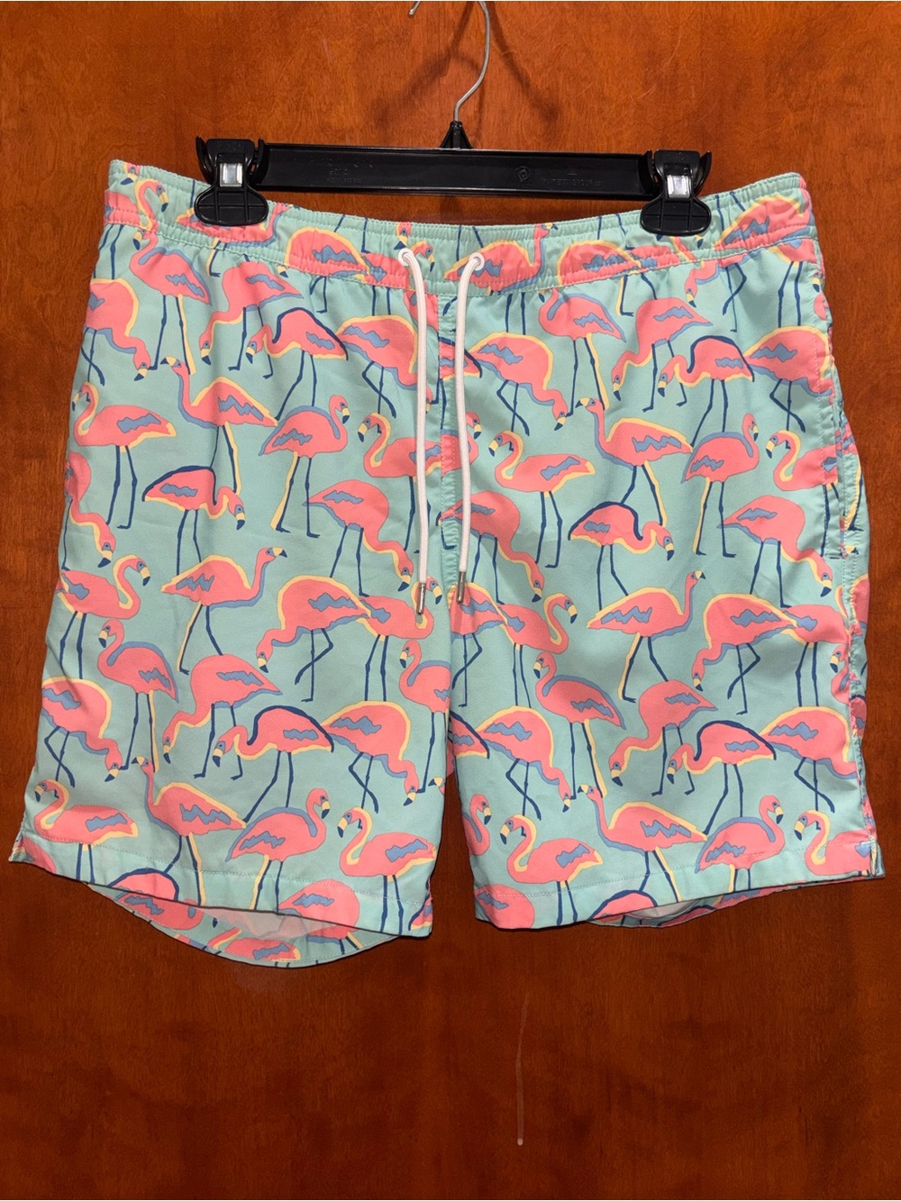 Bonobos Men's Pink Flamingo Print Swim Trunks on Light Blue